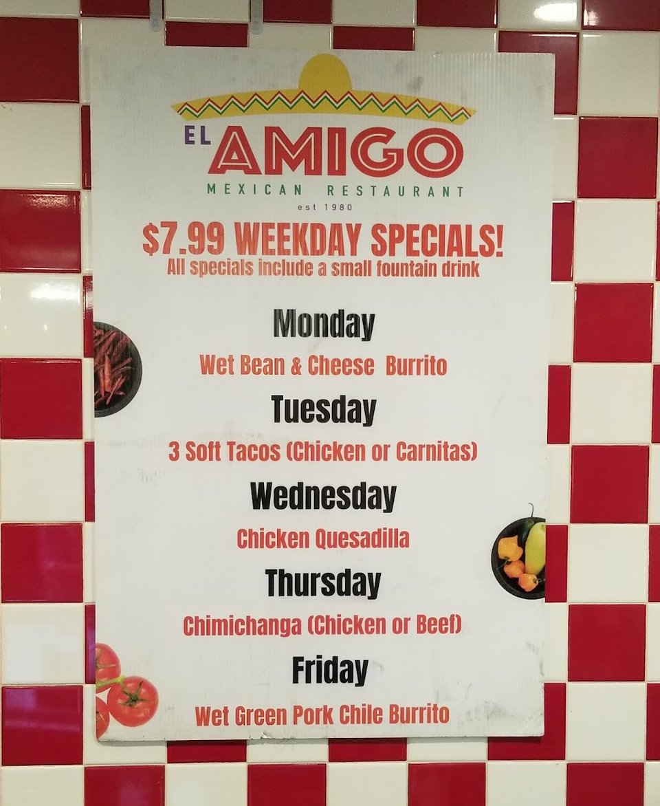 Printed menu with burritos, tacos, and combos.